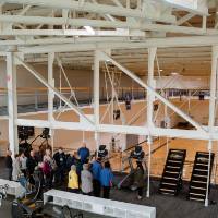 tour group looking over basketball courts